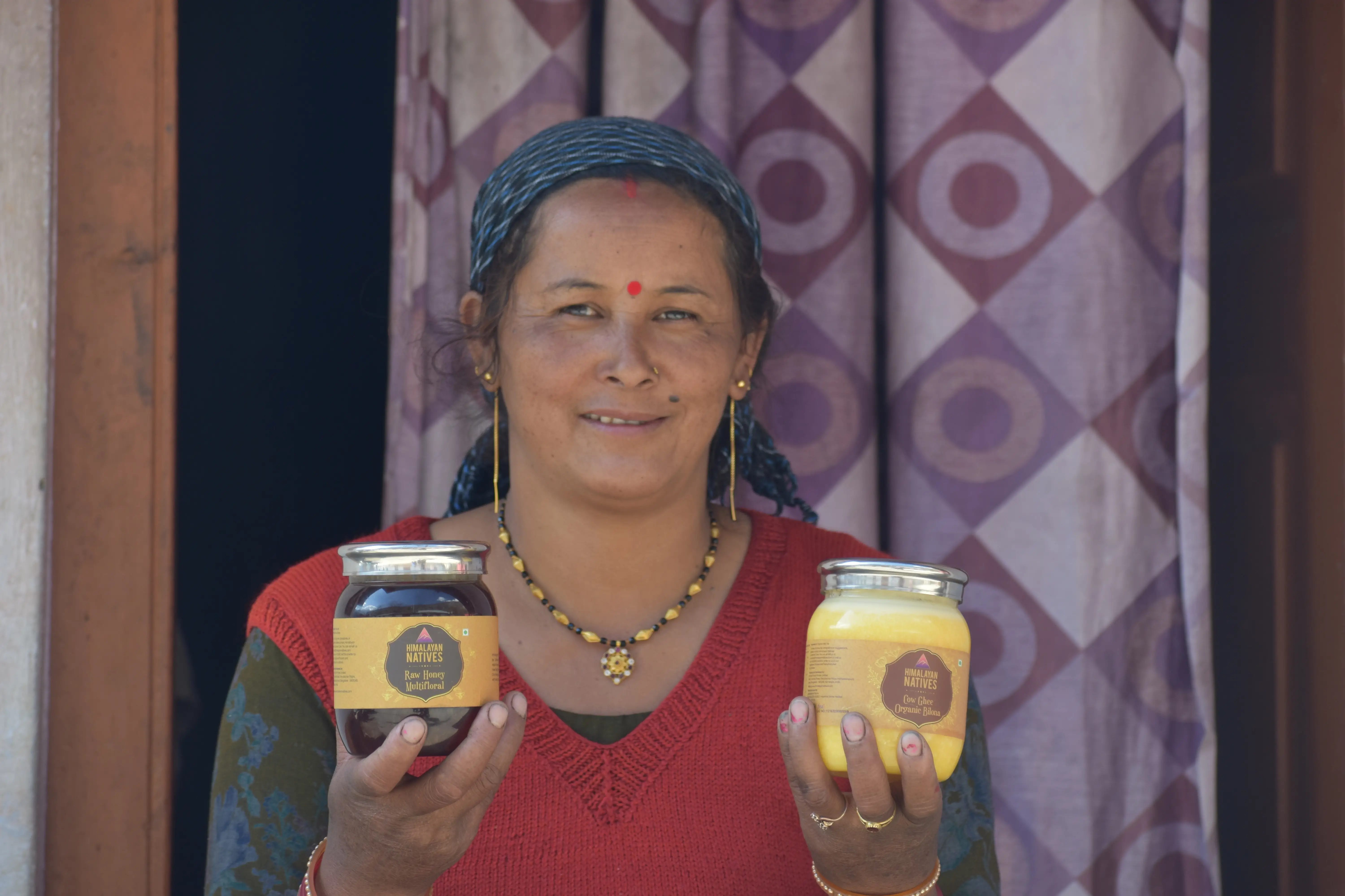 old lady holding with raw honey bilona ghee