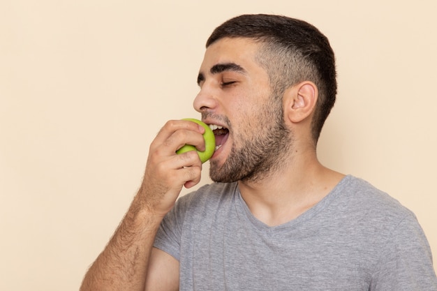 male biting apple